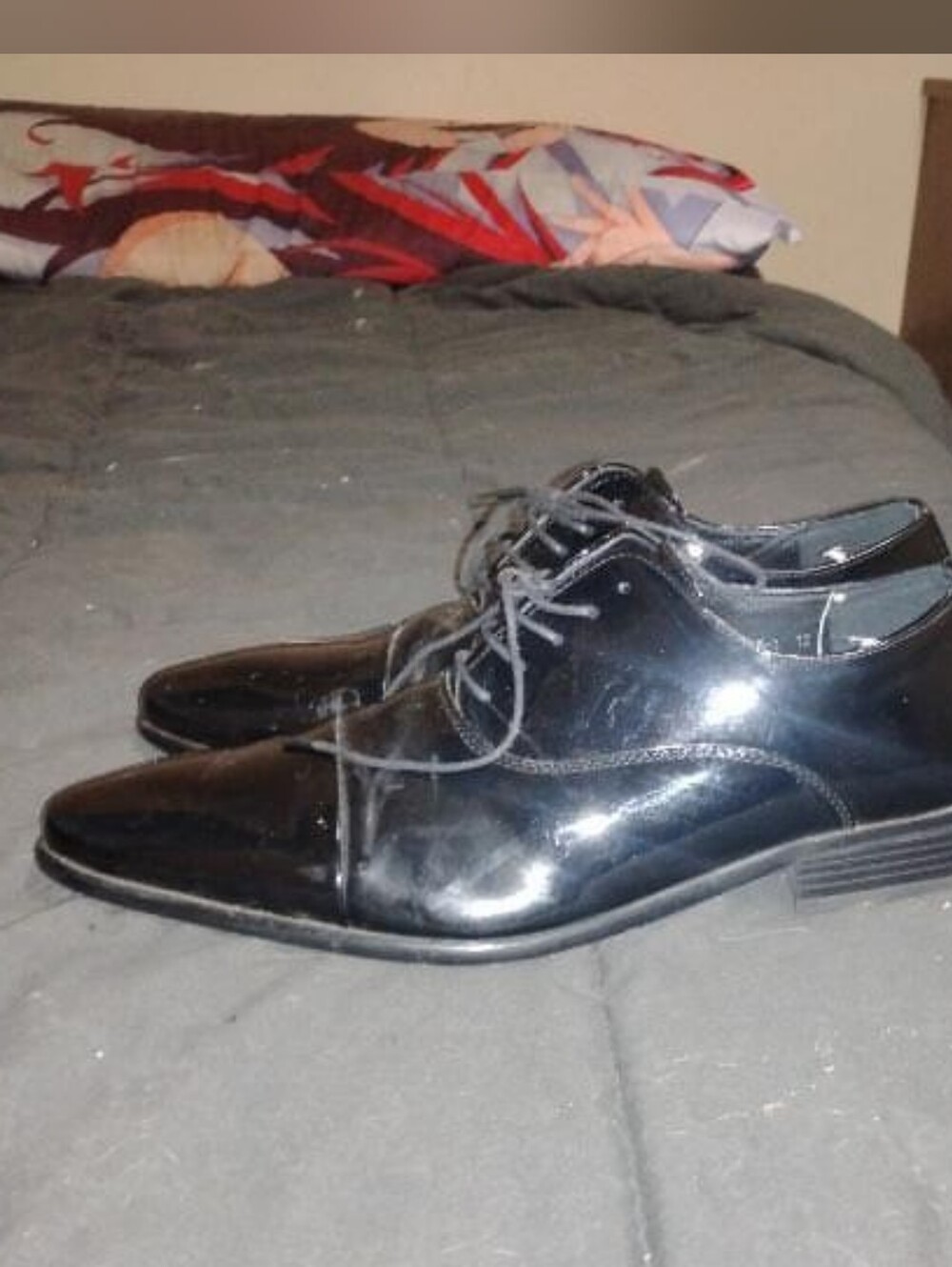 Black leather dress shoes with a sleek, polished look